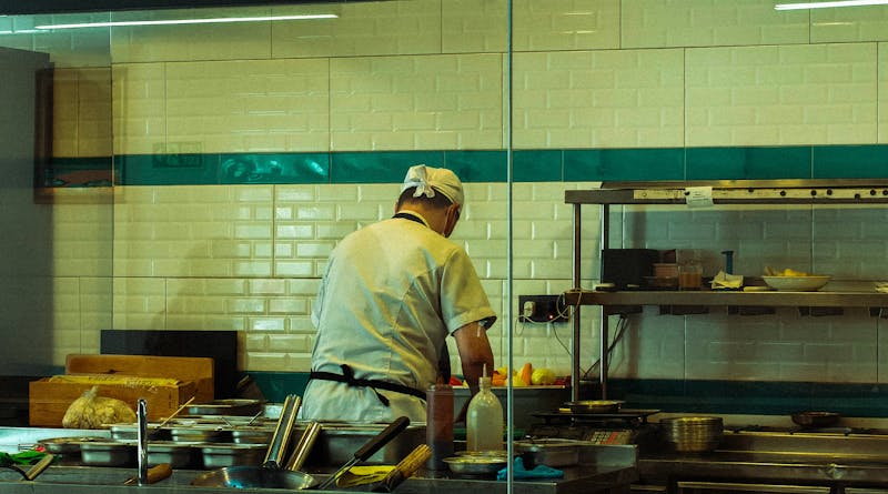 Wing Snob kitchen — fresh chicken wings being prepared with bold sauces